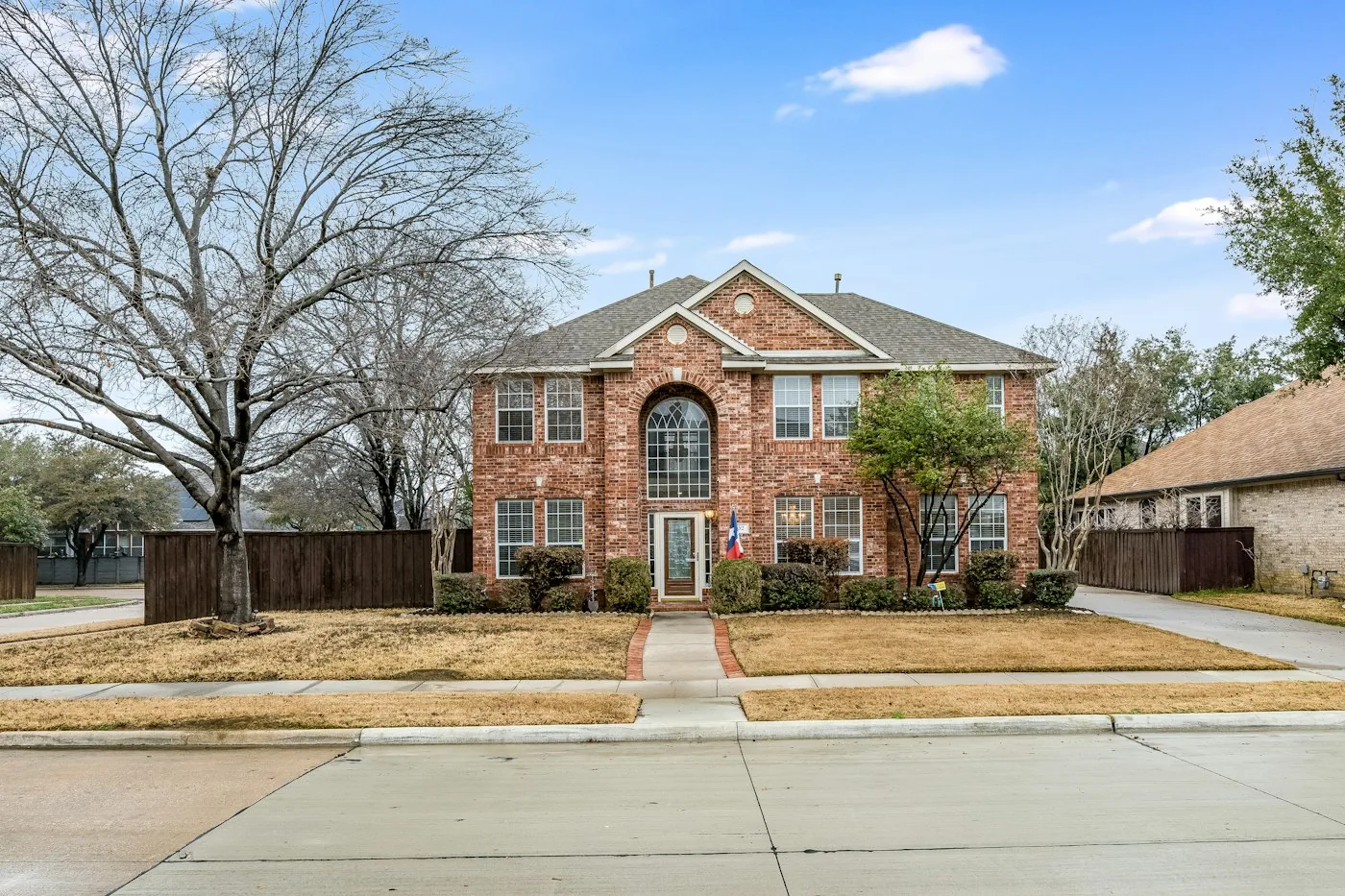 A two-storey brick home on a quiet Cypress street